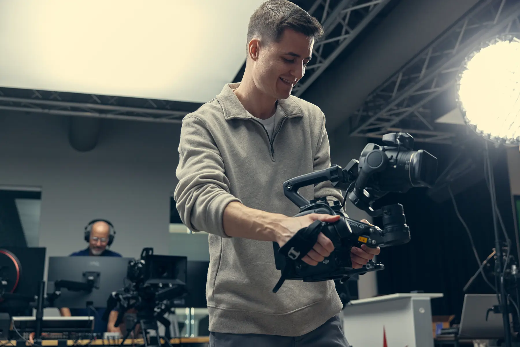 Bailey filming with a handheld camera rig