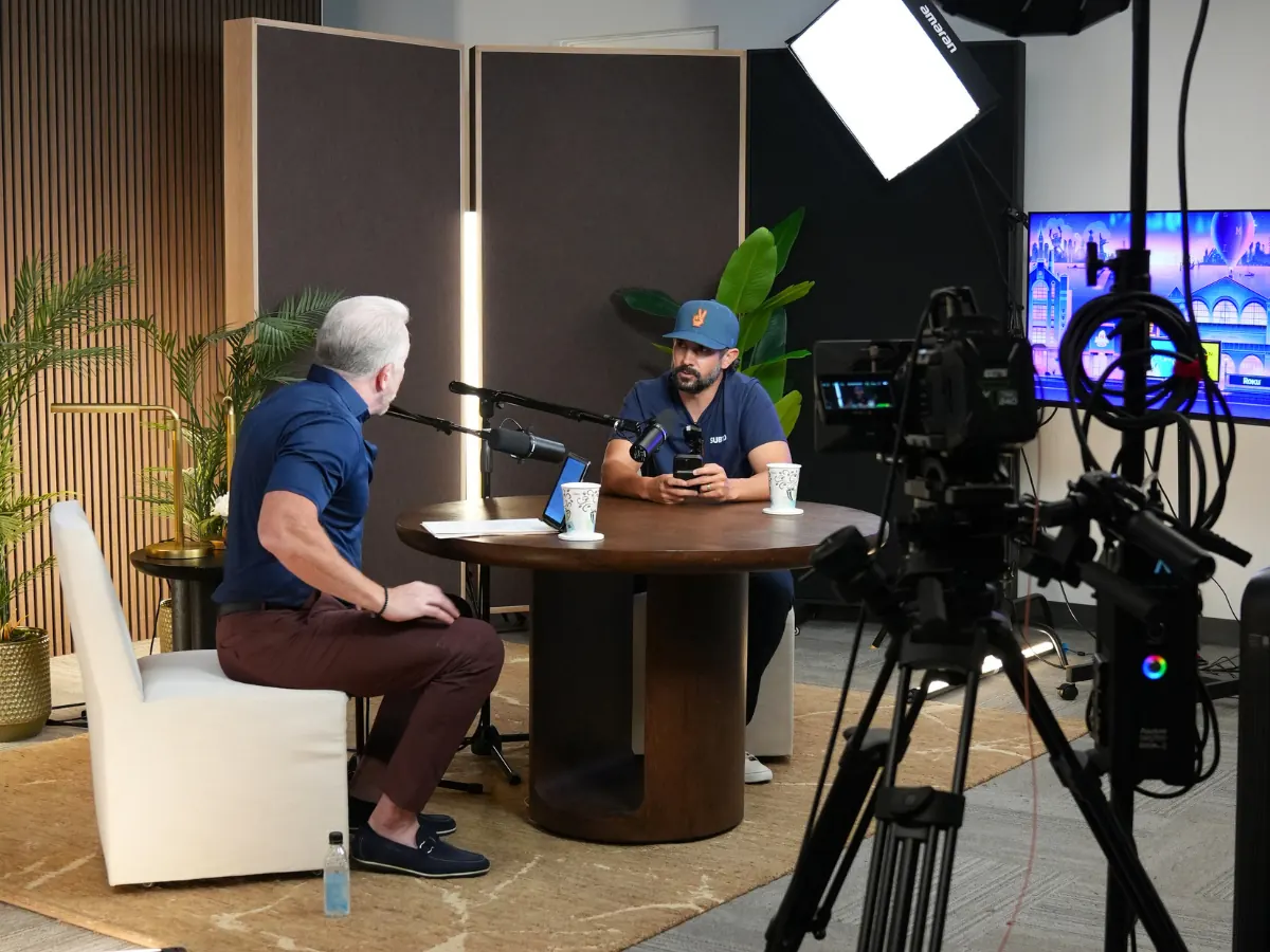 A guest and host recording an episode in the INSPIRED Vibe studio